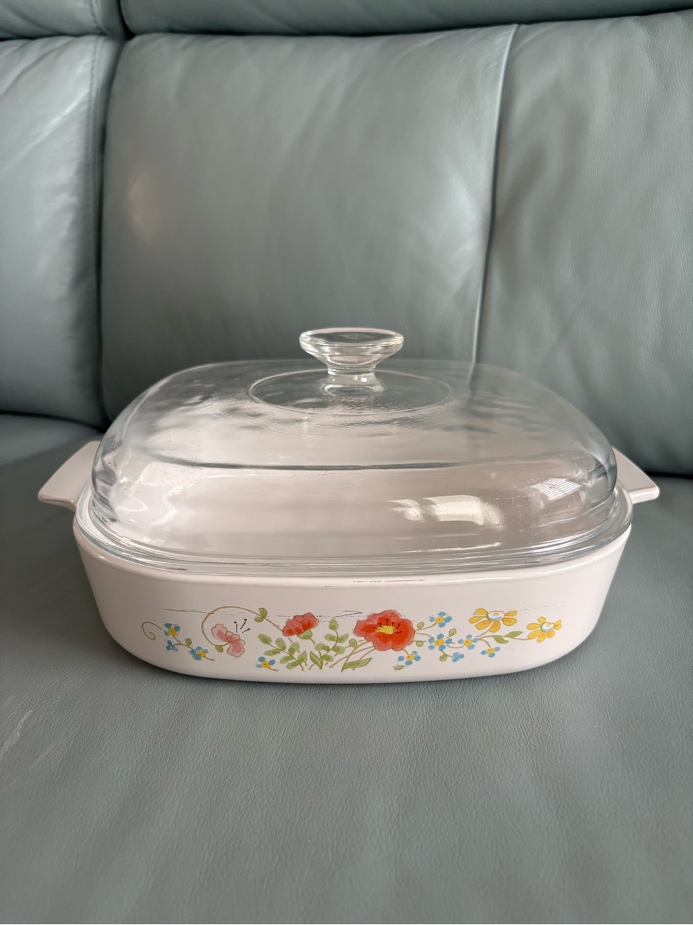 A vintage Corning Ware casserole dish in the Wildflower pattern